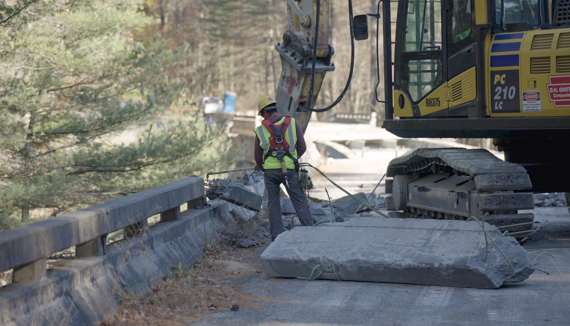 Demolition team clearing the concrete railings of the Laurel Fork Bridge