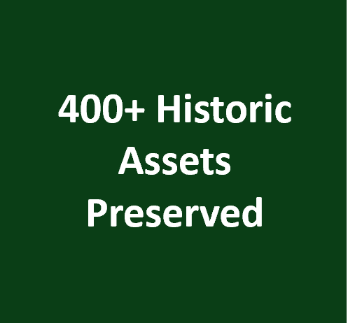 A dark green box with white text that reads “400+ Historic Assets Preserved”