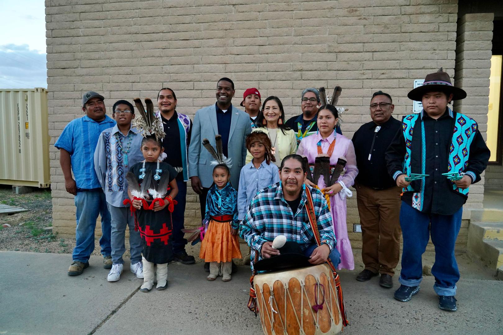 Secretary Haaland's posing for photo with group.