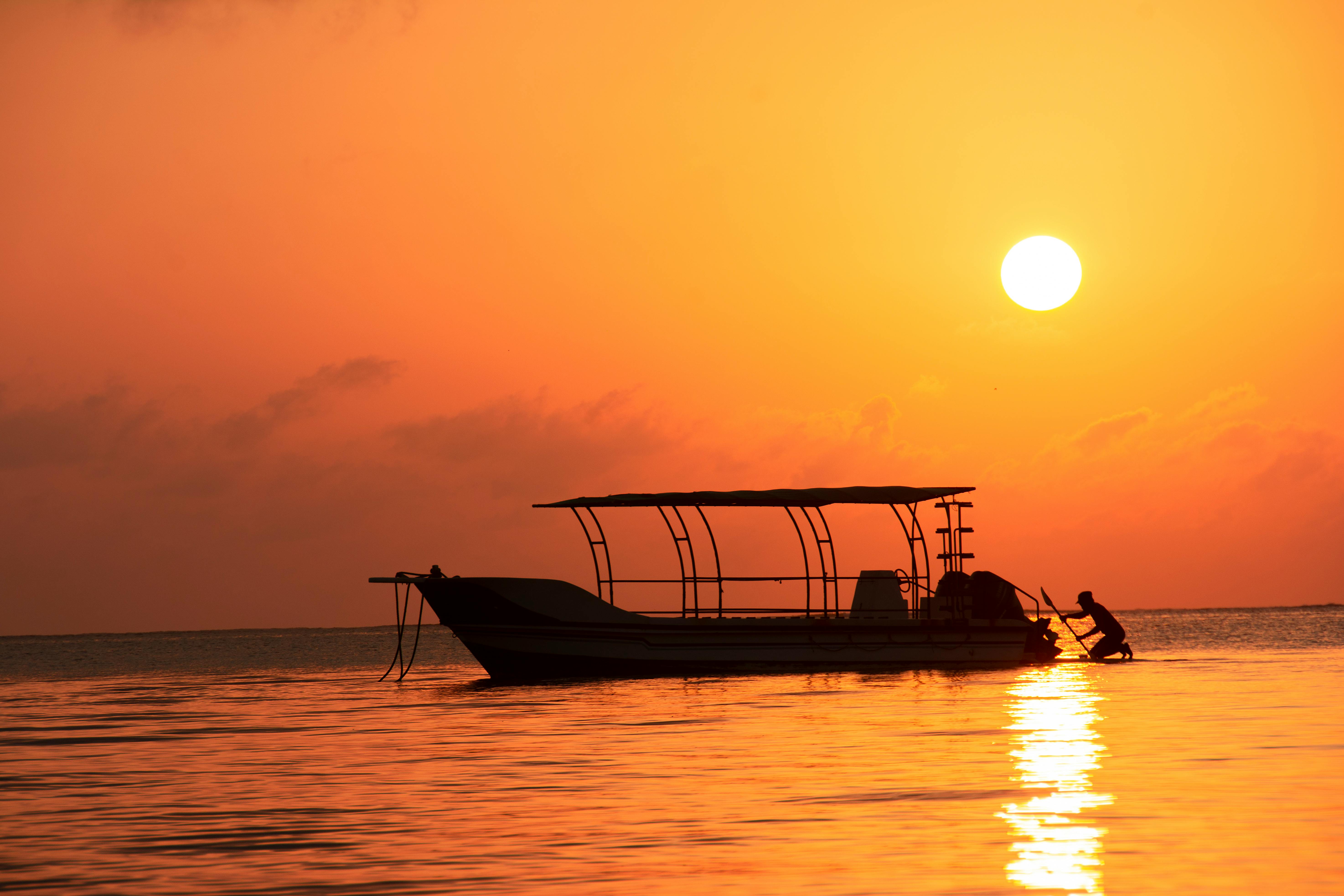 Sunset photo of water and boat near Mombasa