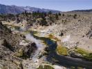 Steam rises from Hot Creek as it flows through the Long Valley Caldera in a volcanically active region of east-central California. 