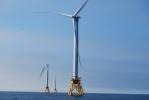 Wind turbines in ocean water.