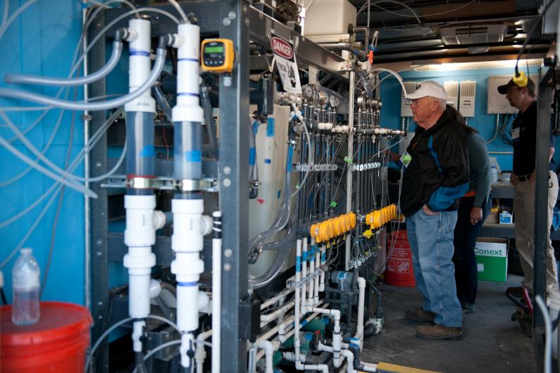 Group of people in a desalination facility. 