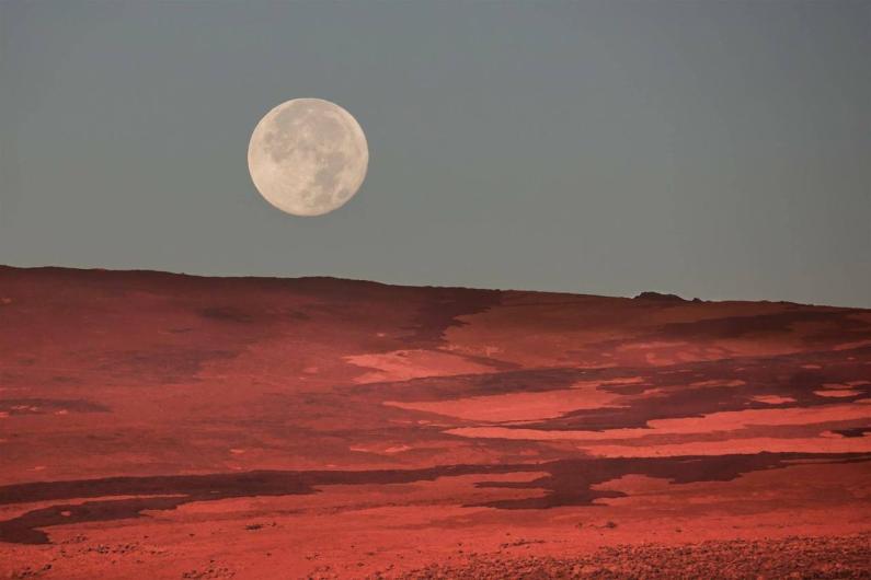 Supermoon over Mauna Loa at Hawaii Volcanoes National Park. 