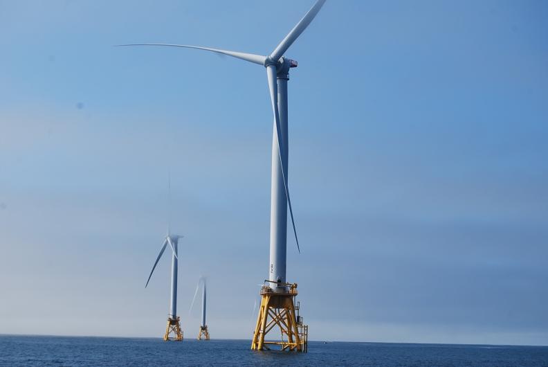 Wind turbines in ocean water.