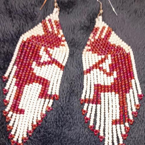 Beaded red and white dangling earrings.