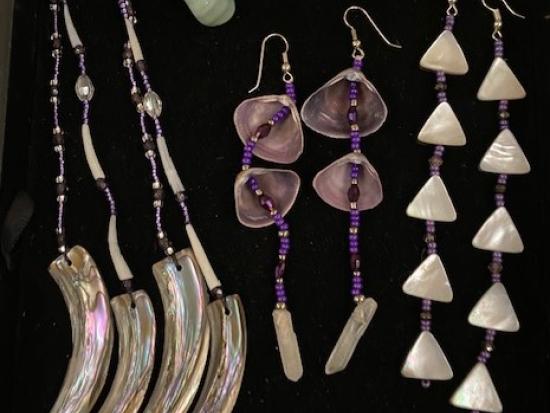 Photograph of earrings with shells, beads, and dentalium.
