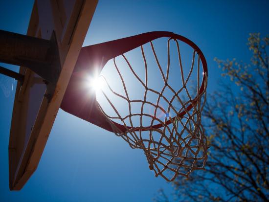 Photo of basketball hoop in the sun
