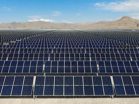 Solar panels in desert landscape. 