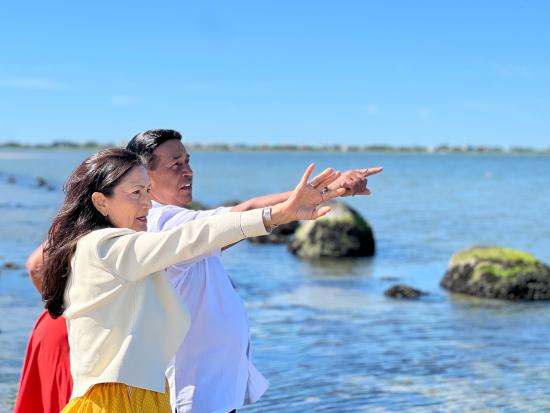 Secretary Haaland pointing in front of water