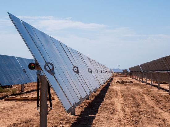 Solar panels at a construction site in a desert landscape