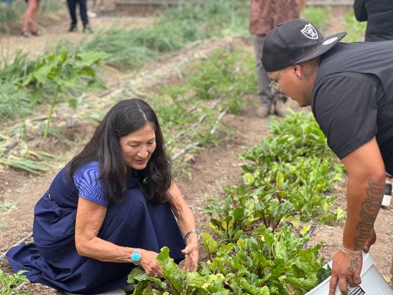 Secretary Haaland planting a garden with Indian Youth Service Corps members