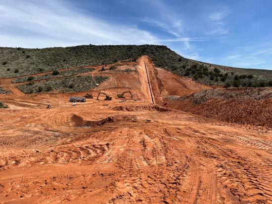 Construction area with reddish dirt. 