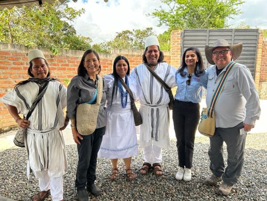 Secretary Haaland and 5 others pose for photo during visit to Colombia