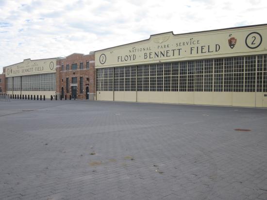 Large field house building with NPS logo.