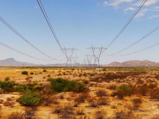 Transmission towers in a desert landscape