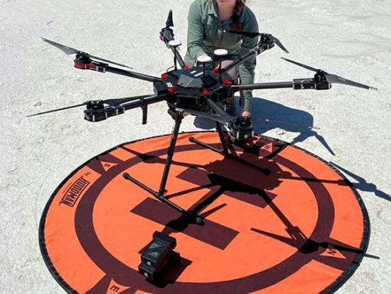 Victoria Scholl (USGS National Uncrewed Systems Office) at White Sands National Park, New Mexico mapping fossilized tracks