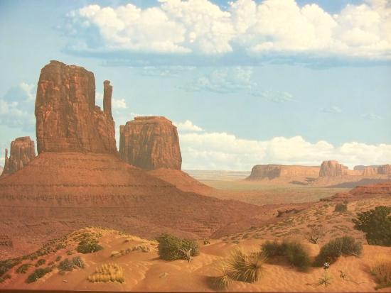Painting of an arid landscape showing buttes and mesas