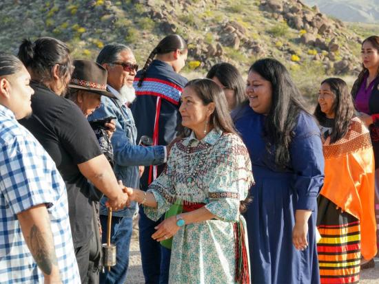 Secretary Haaland greets Tribal members during the designation of Avi Kwa Ame National Monument