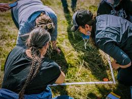 People gather at the Spokane Food Sovereign Garden to establish fire effects monitoring plots. Photo courtesy of the Spokane Tribal Network.