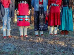 Five people wearing moccasins