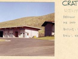 Archival photo of utility building with handwritten label from building construction in 1957.