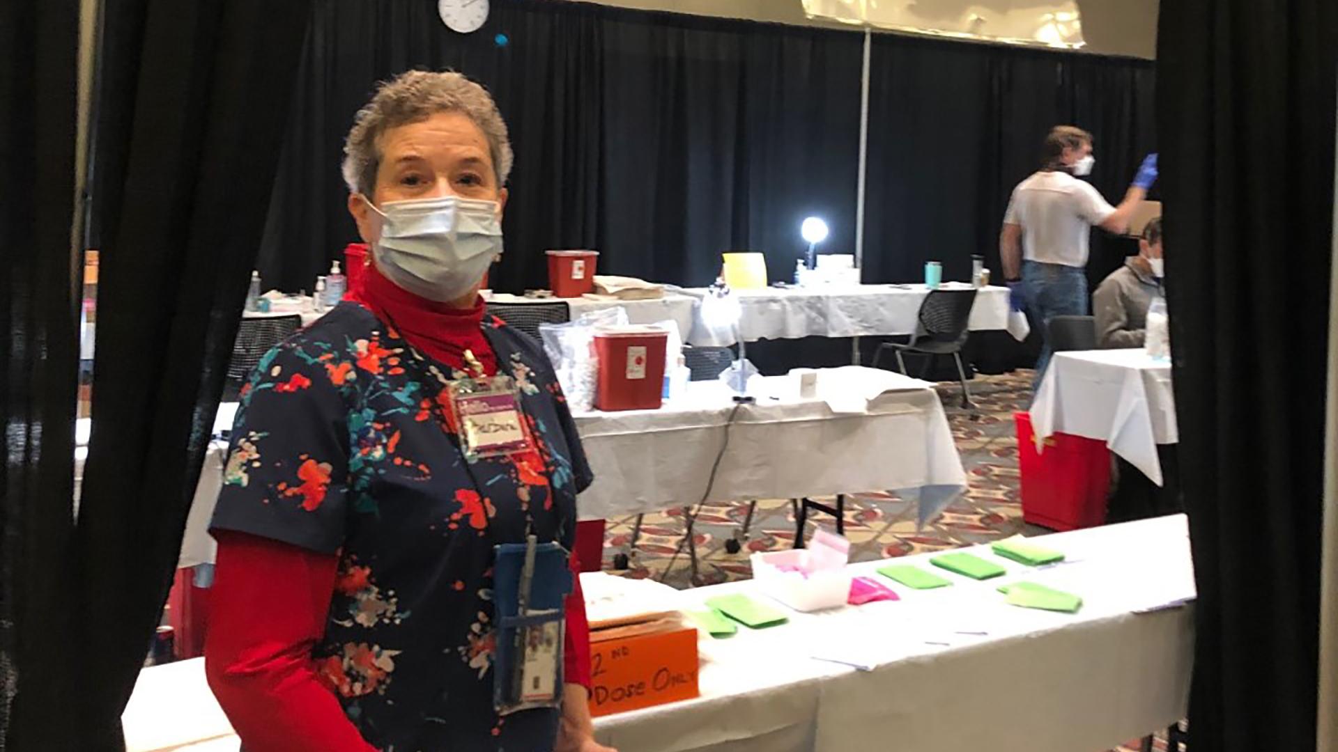 Nurse Hayden standing inside the Wisconsin Center vaccination clinic. 