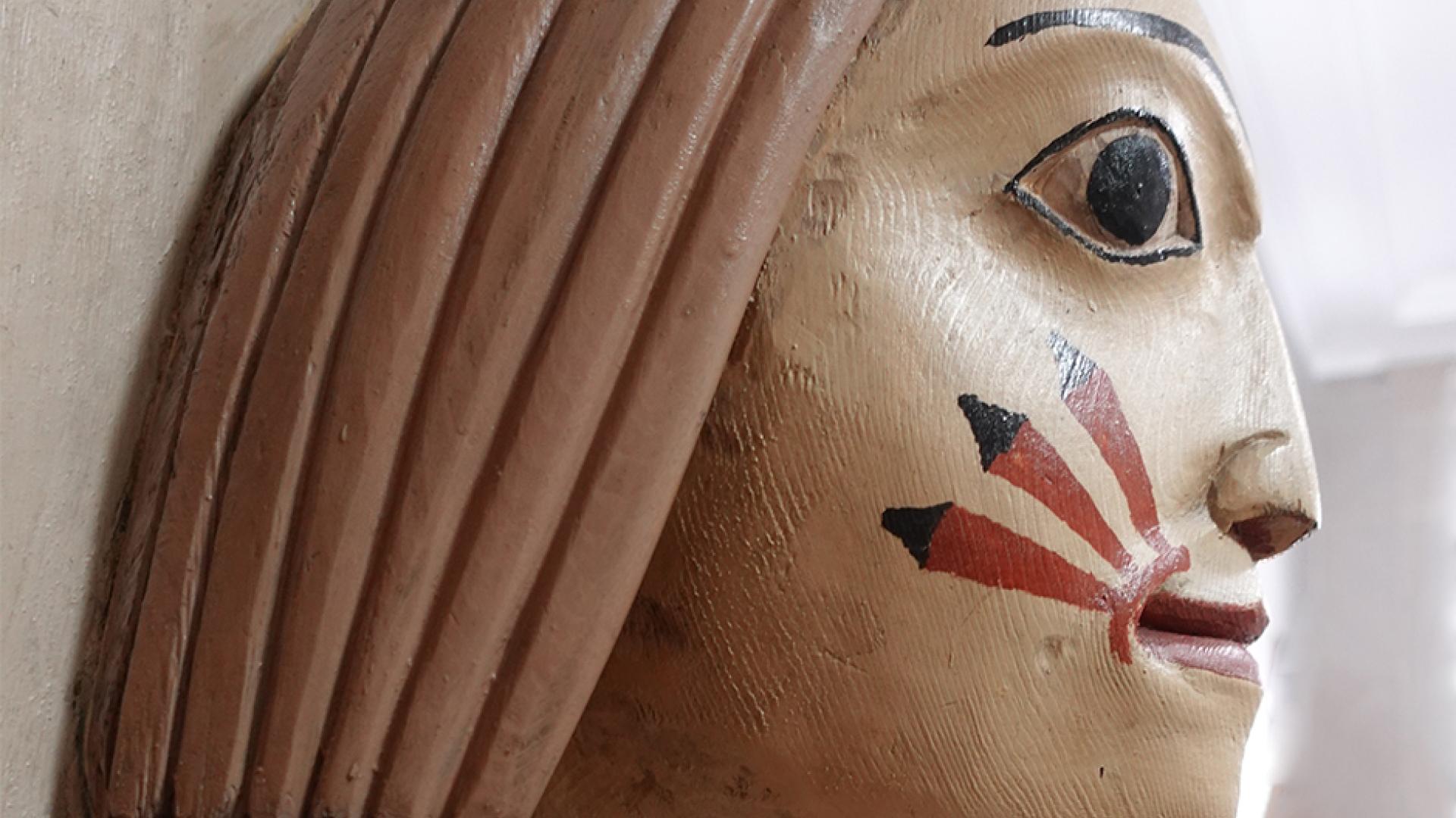 carved, painted detail from "The Chief's Daughter" story pole
