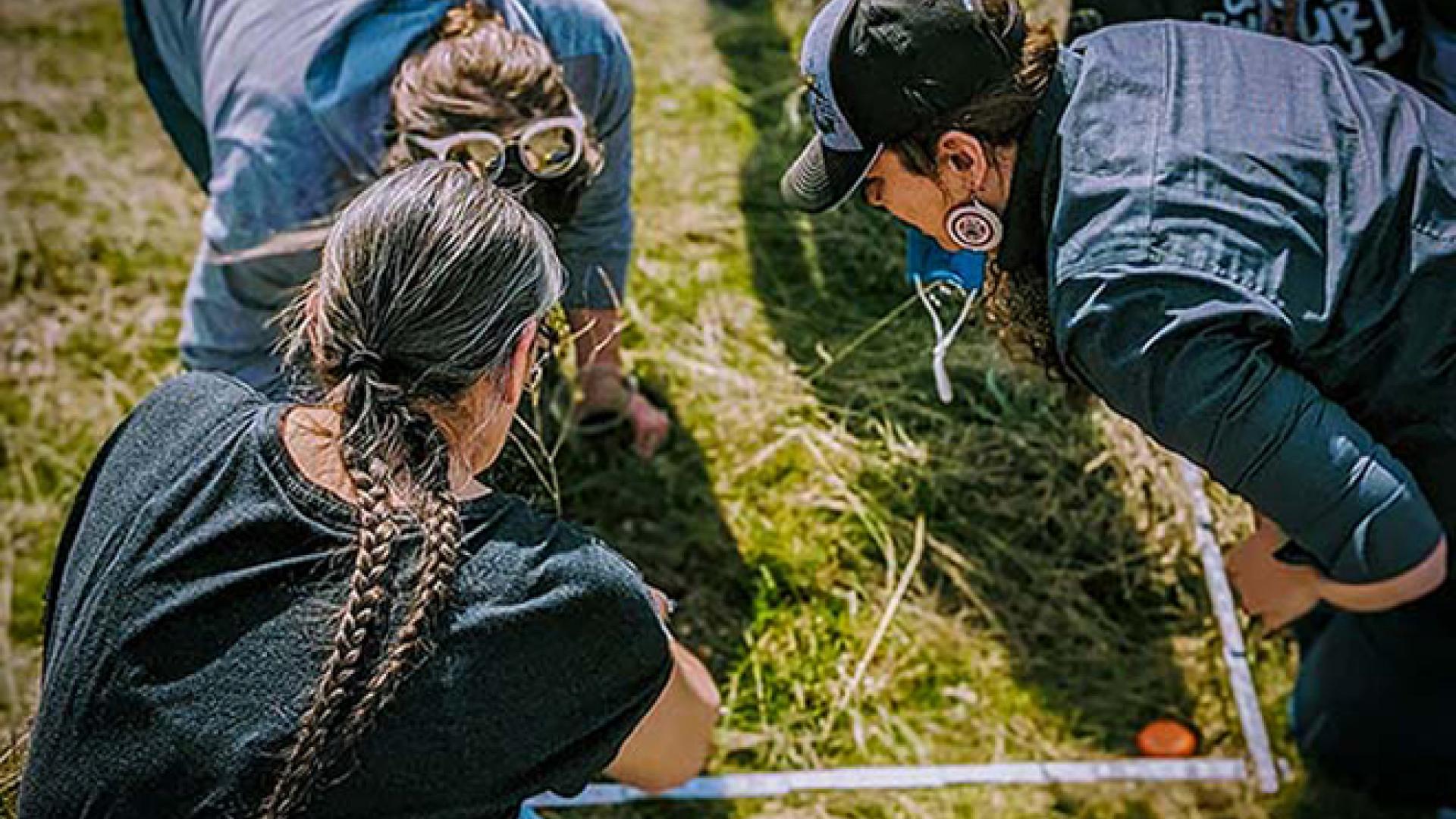 People gather at the Spokane Food Sovereign Garden to establish fire effects monitoring plots. Photo courtesy of the Spokane Tribal Network.