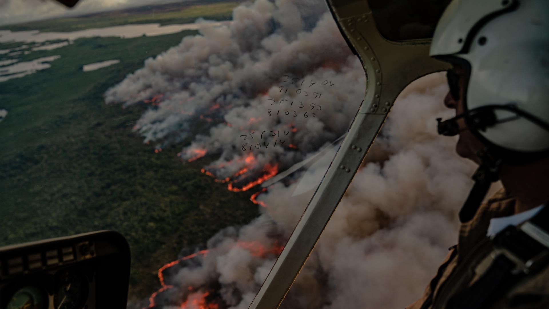 National Park Service fire and aviation management personnel monitor a prescribed fire in Florida from the air.