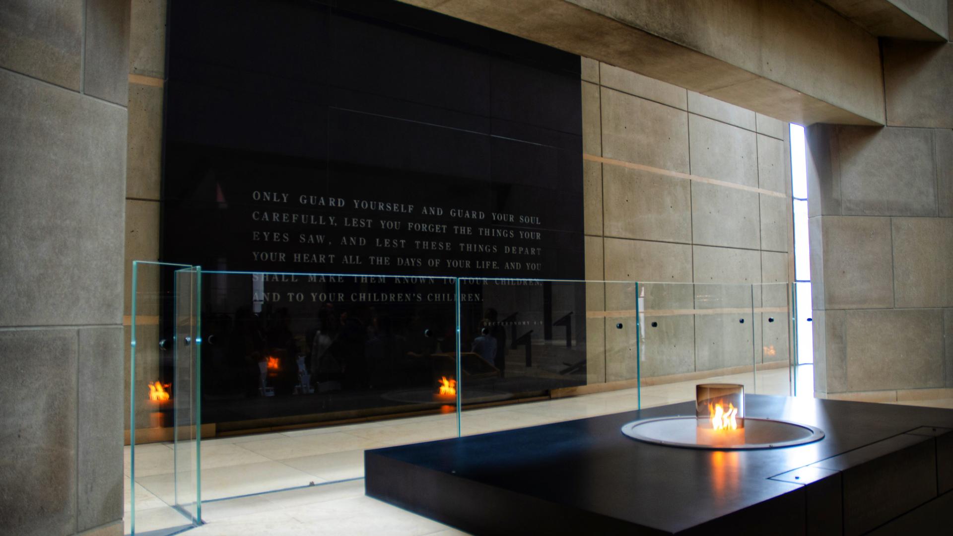 Photo of the Holocaust Museum’s Hall of Remembrance, candle burning on pedestal.  