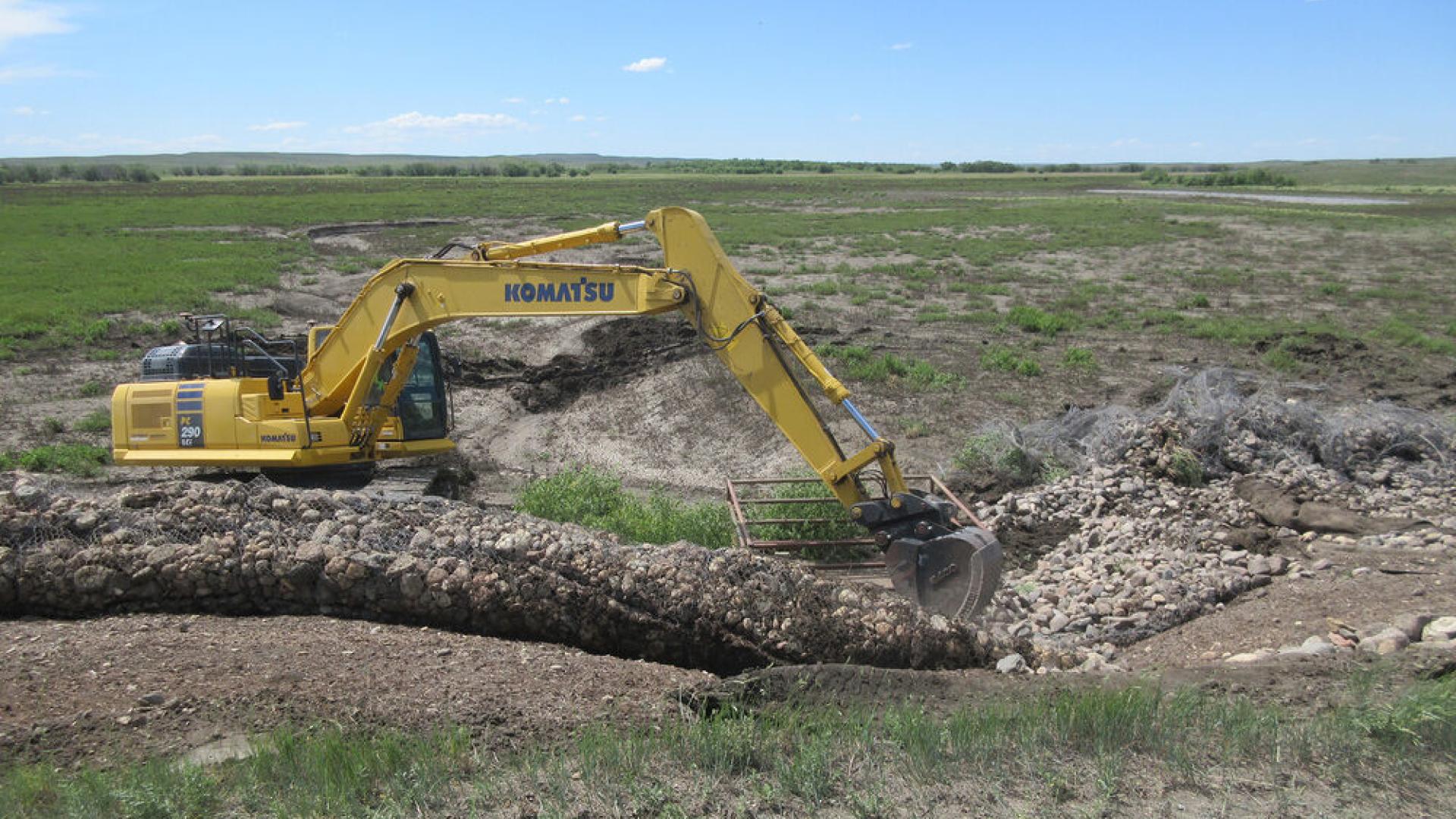 Heavy equipment is being used to dig up the ground. 