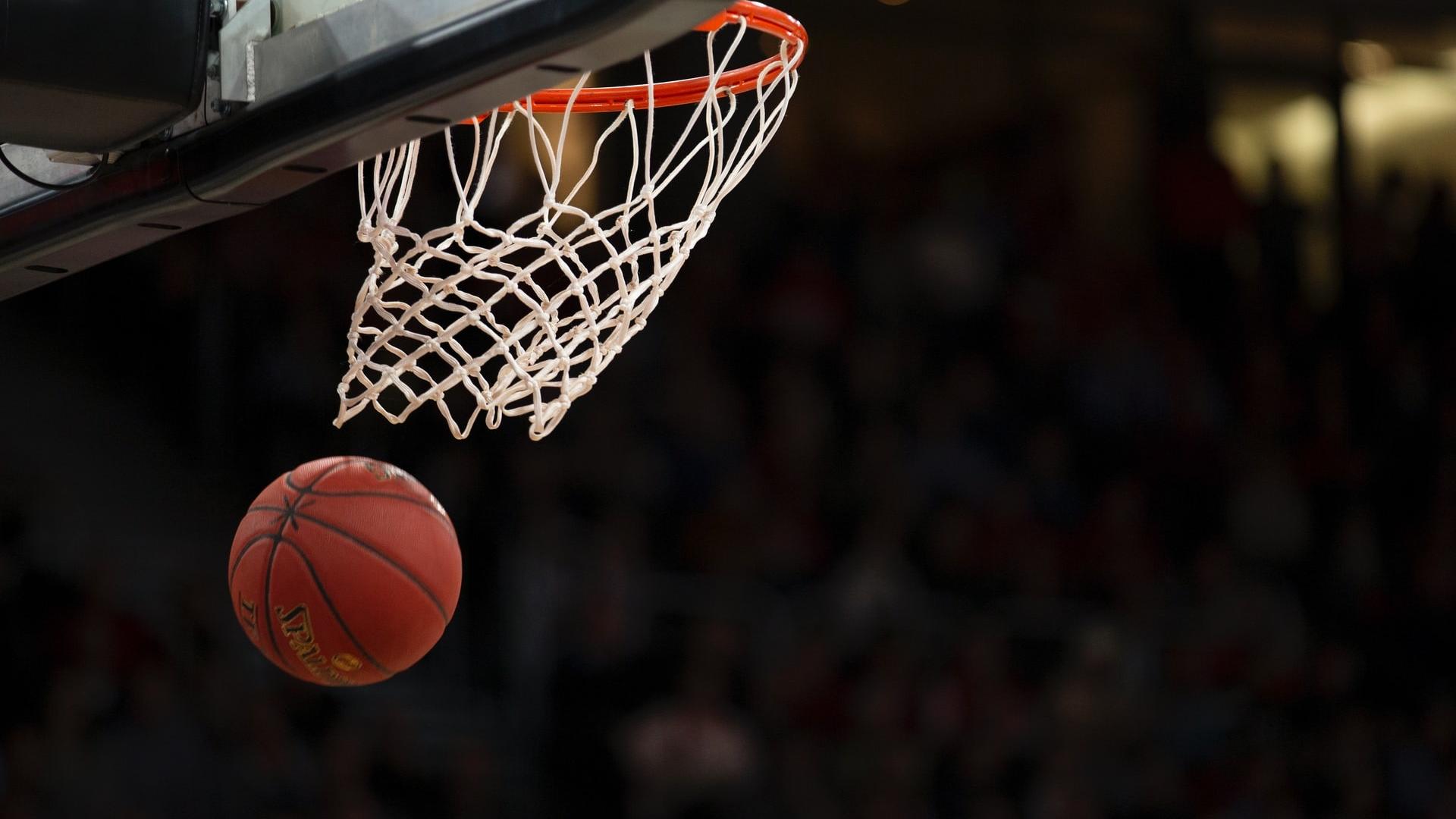 Photo of basketball going through hoop