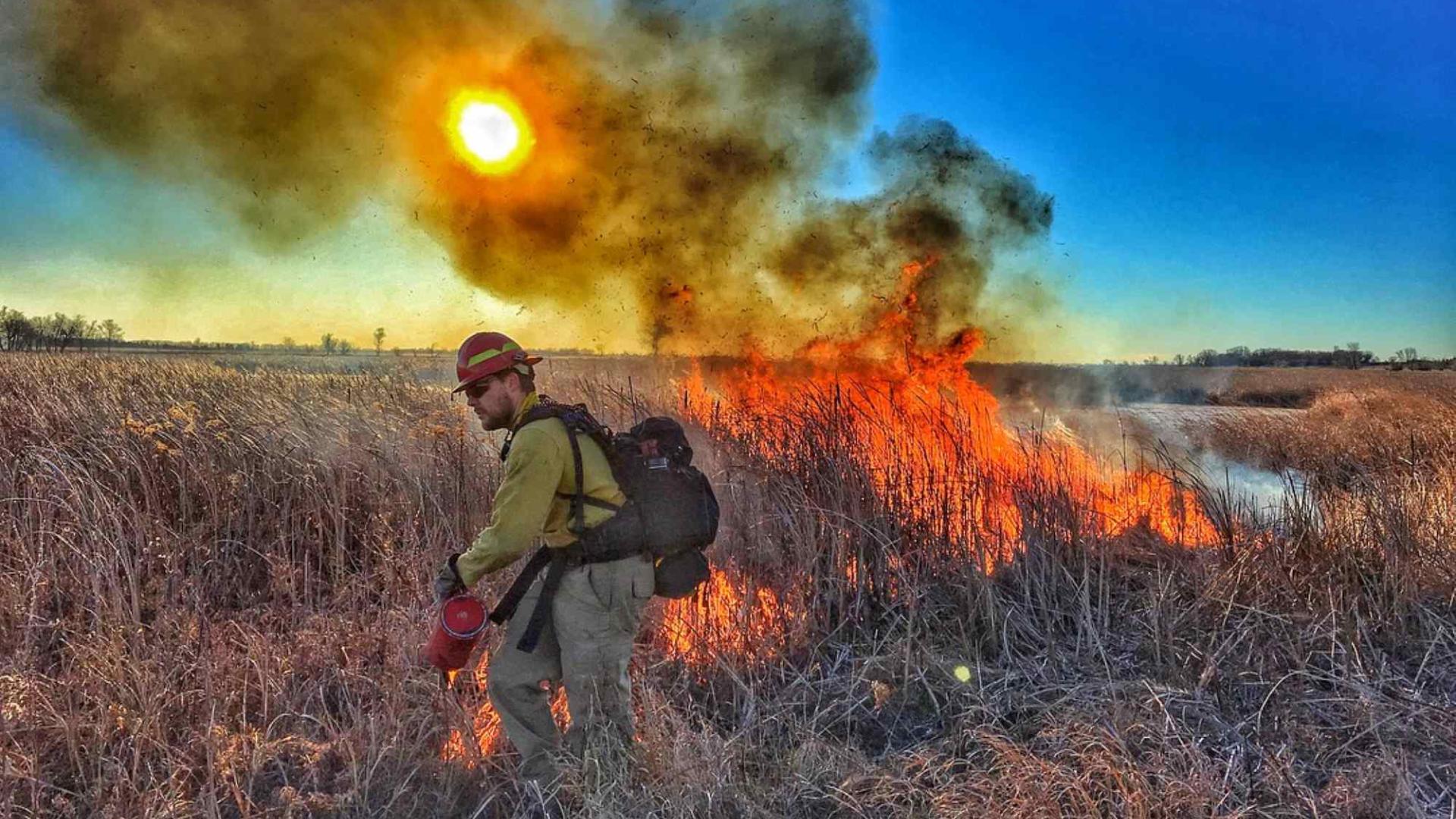 A wildland firefighter on a prescribed burn