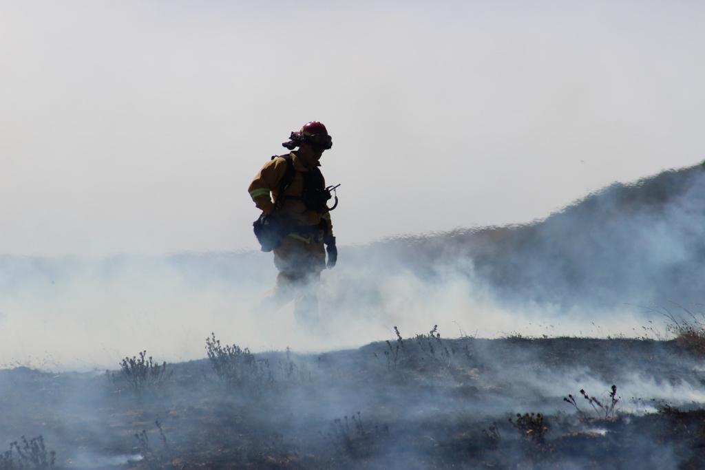 Firefighter stands in smoke at the Soberanes Fire.