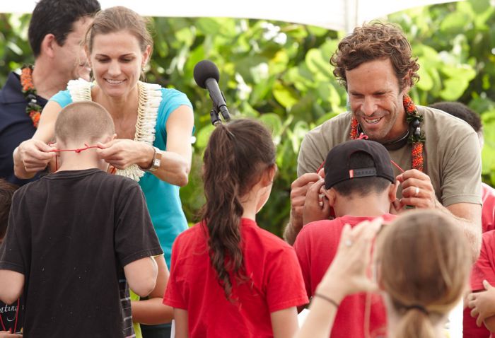 Jack and Kim Johnson distribute Every Kid in a Park passes to 4th-graders in Hawai‘i. Photo by Ryan Foley.
