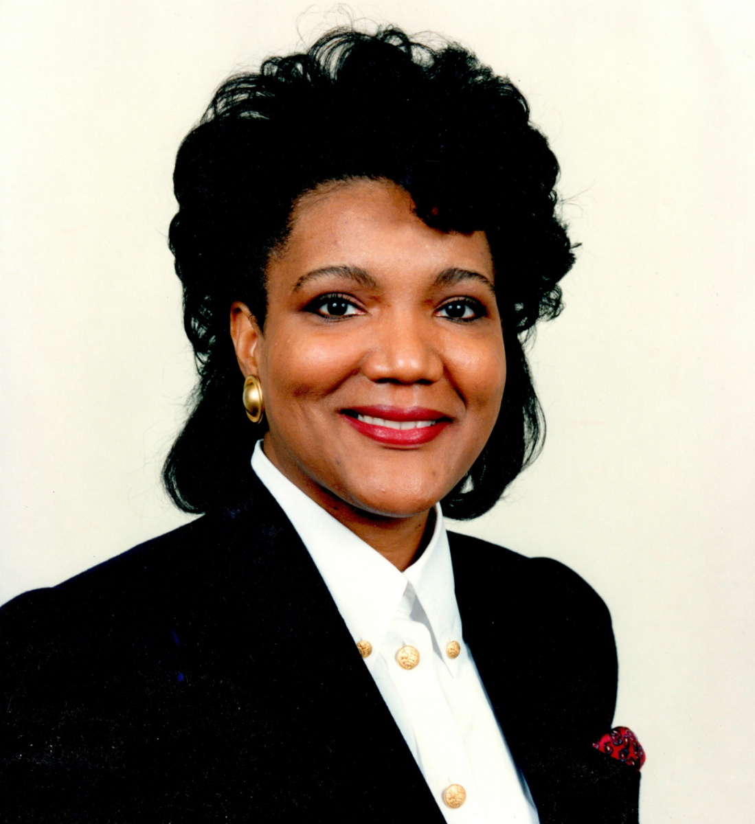 Photo of Cynthia Quaterman -- an African American woman wearing a business suit and smiling at the camera.