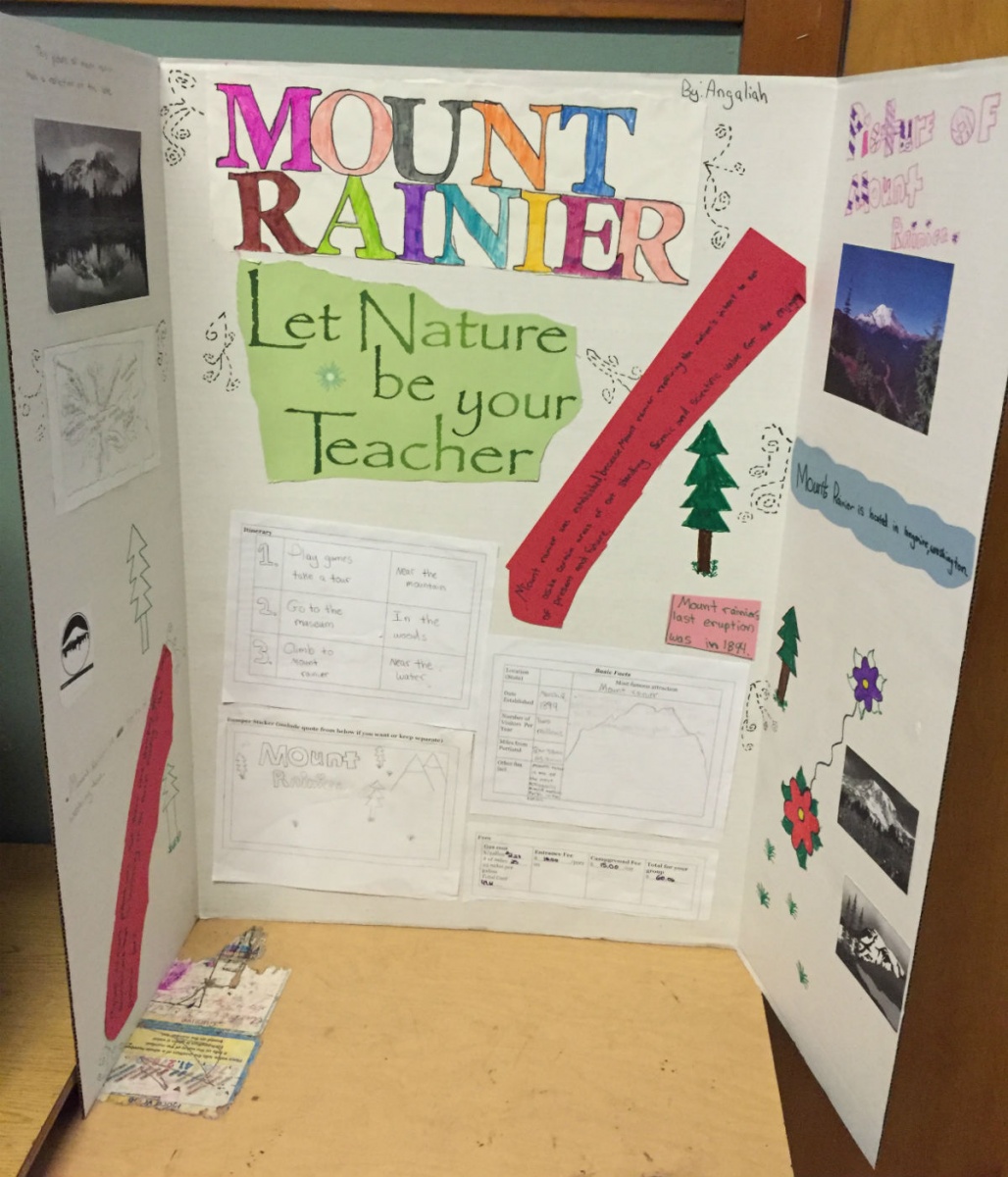 A vertical school project poster board that says "Mount Rainier - Let Nature Be Your Teacher."