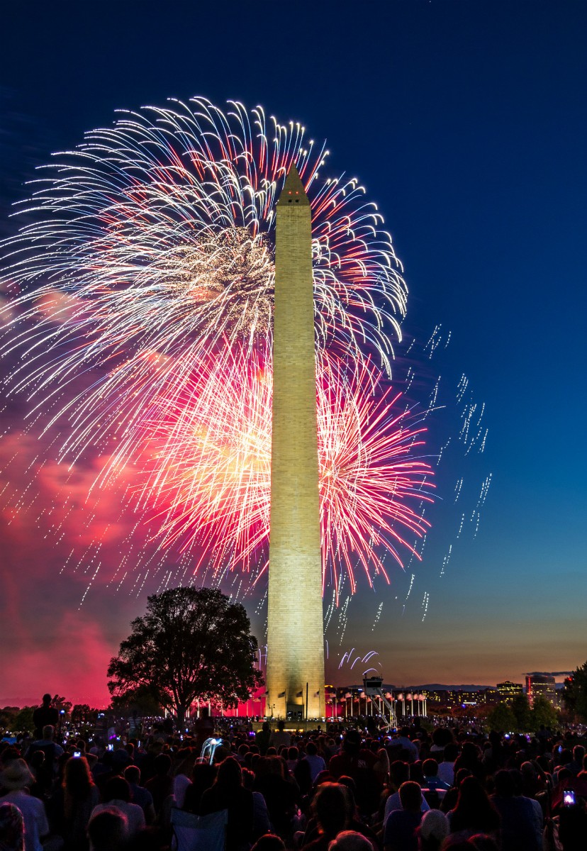 Red, white and blue fireworks behind Washington Monument.