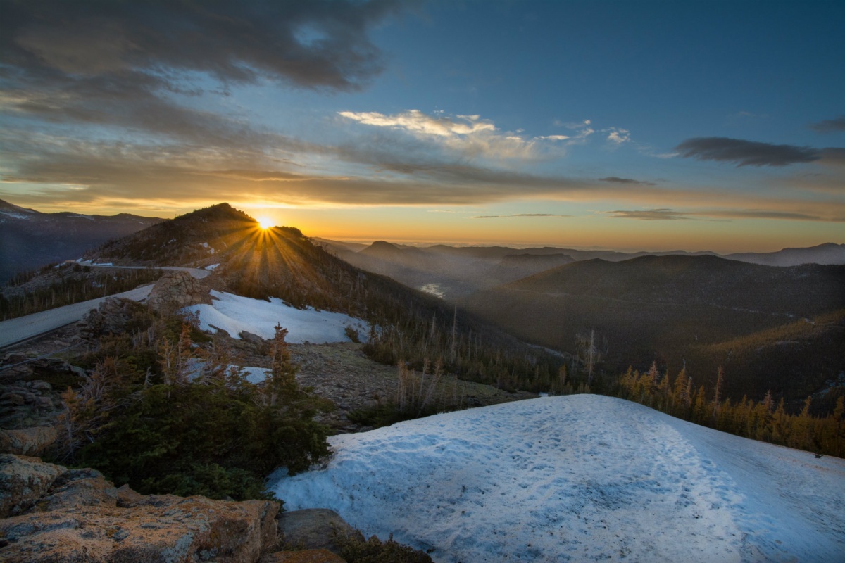 Sunrise over a mountain with snow in Rocky Mountain National Park