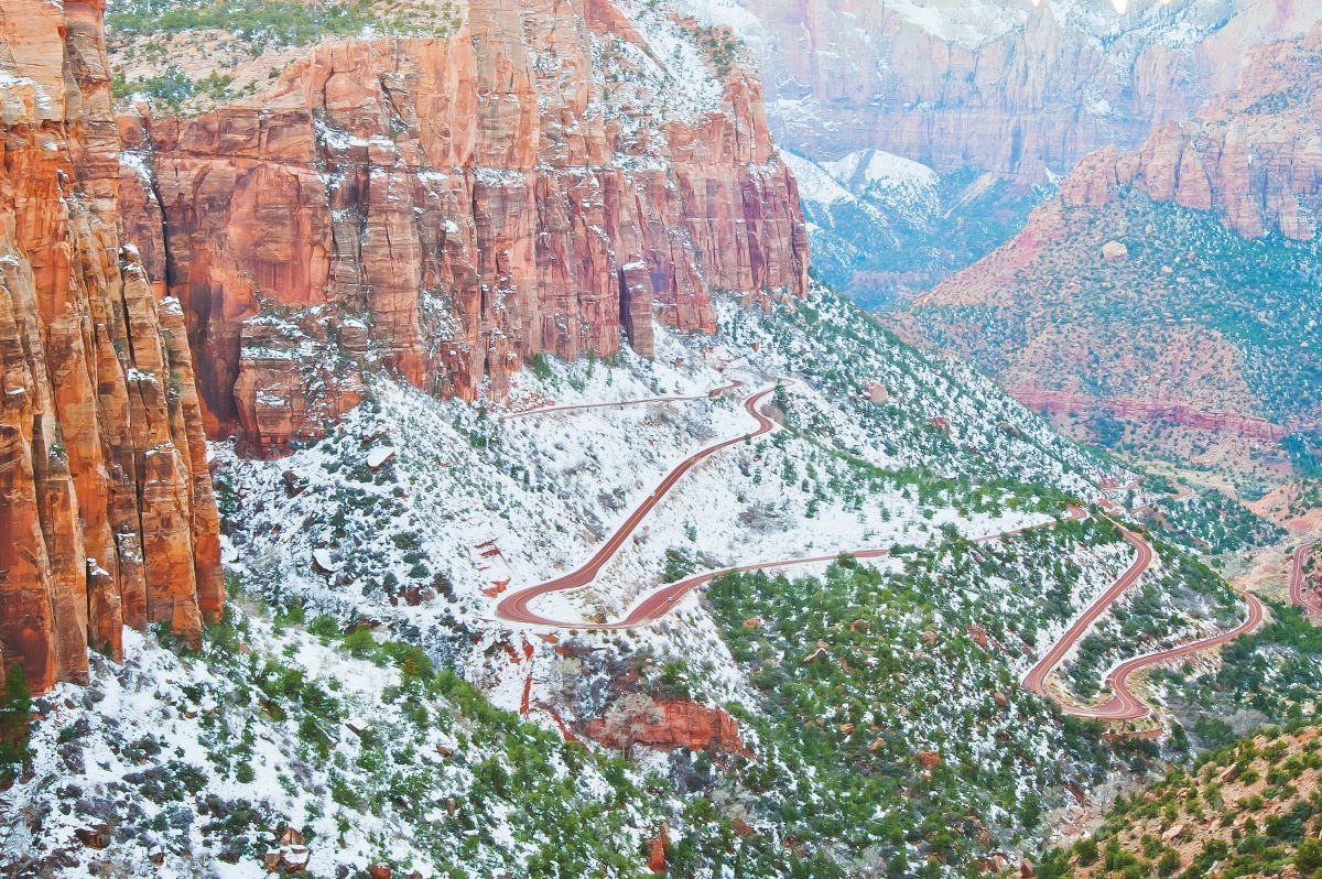 Zion-Mt. Carmel Highway winding up a mountain topped with snow